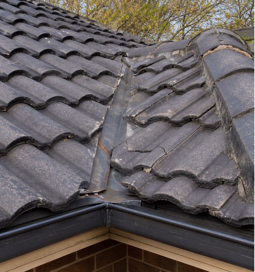 Tiled roof with localised damage before repair